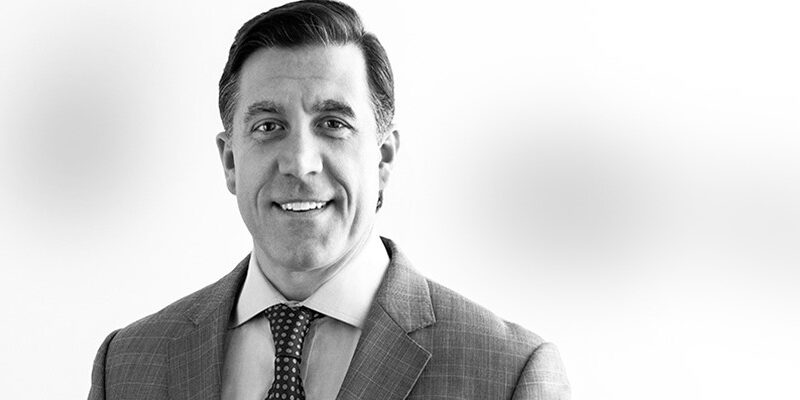 Black and white headshot of Scott Chenevert