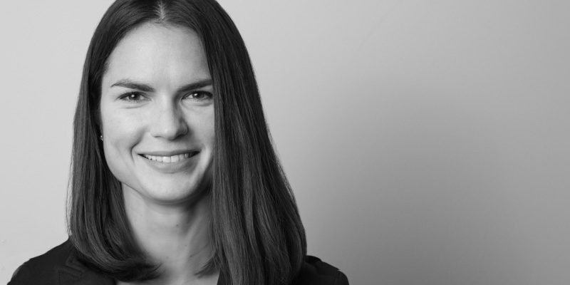 Black and white headshot of Molly Wells